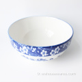 mavi ve beyaz porselen yemek kasesi